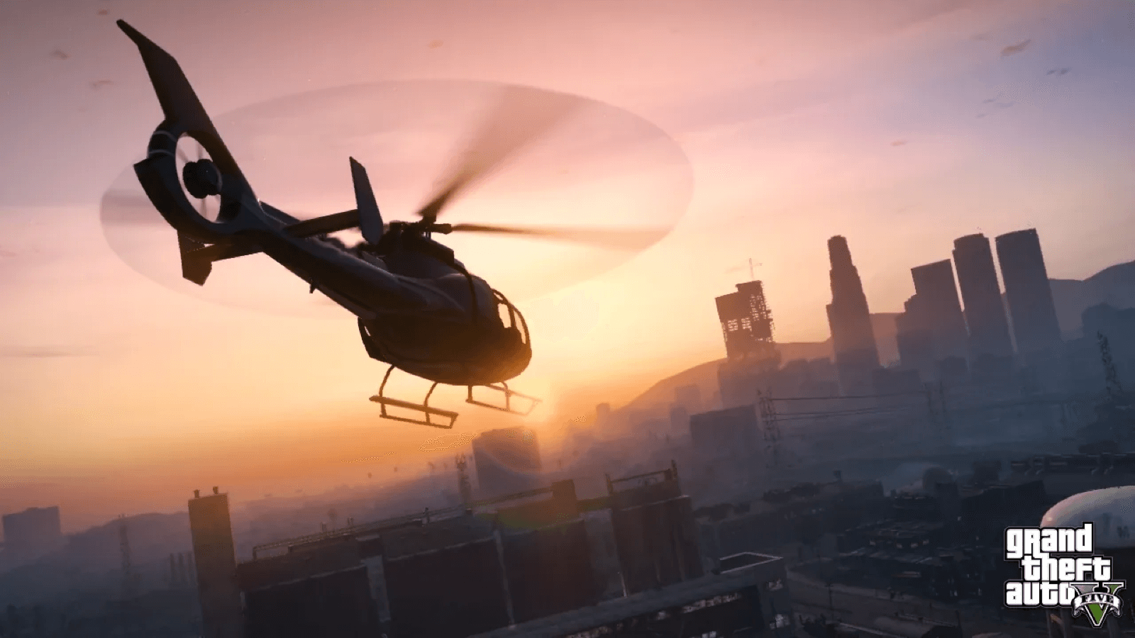 A helicopter flying over downtown Los Santos at sunset in GTA 5