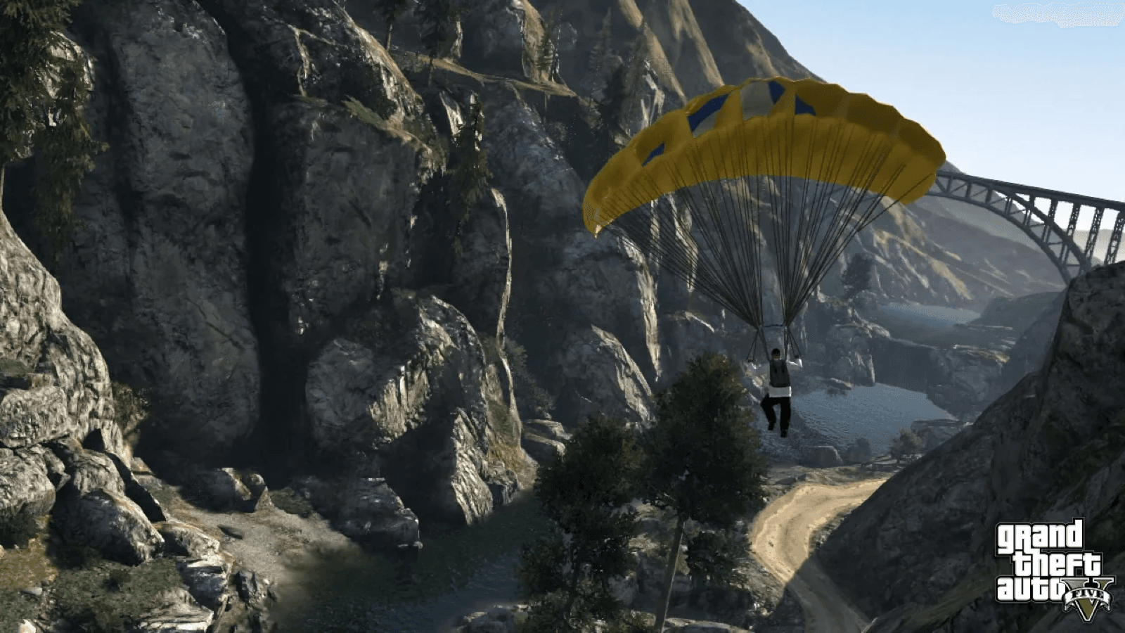 A BASE jumper descending into a rugged canyon in GTA 5