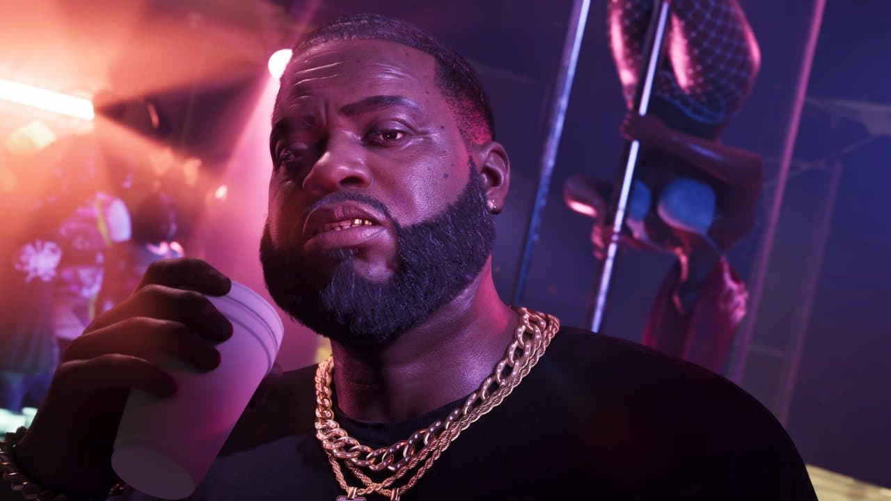 Boobie Ike inside the Jack of Hearts strip club, gold chains and a styrofoam cup in hand, Grand Theft Auto VI