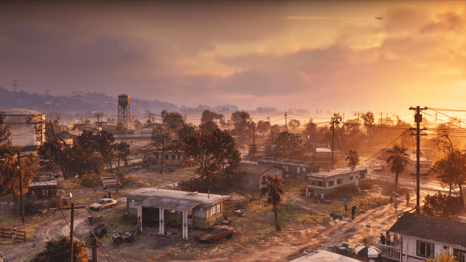 A faded coastal town in Port Gellhorn glowing at sunset in GTA 6, official screenshot