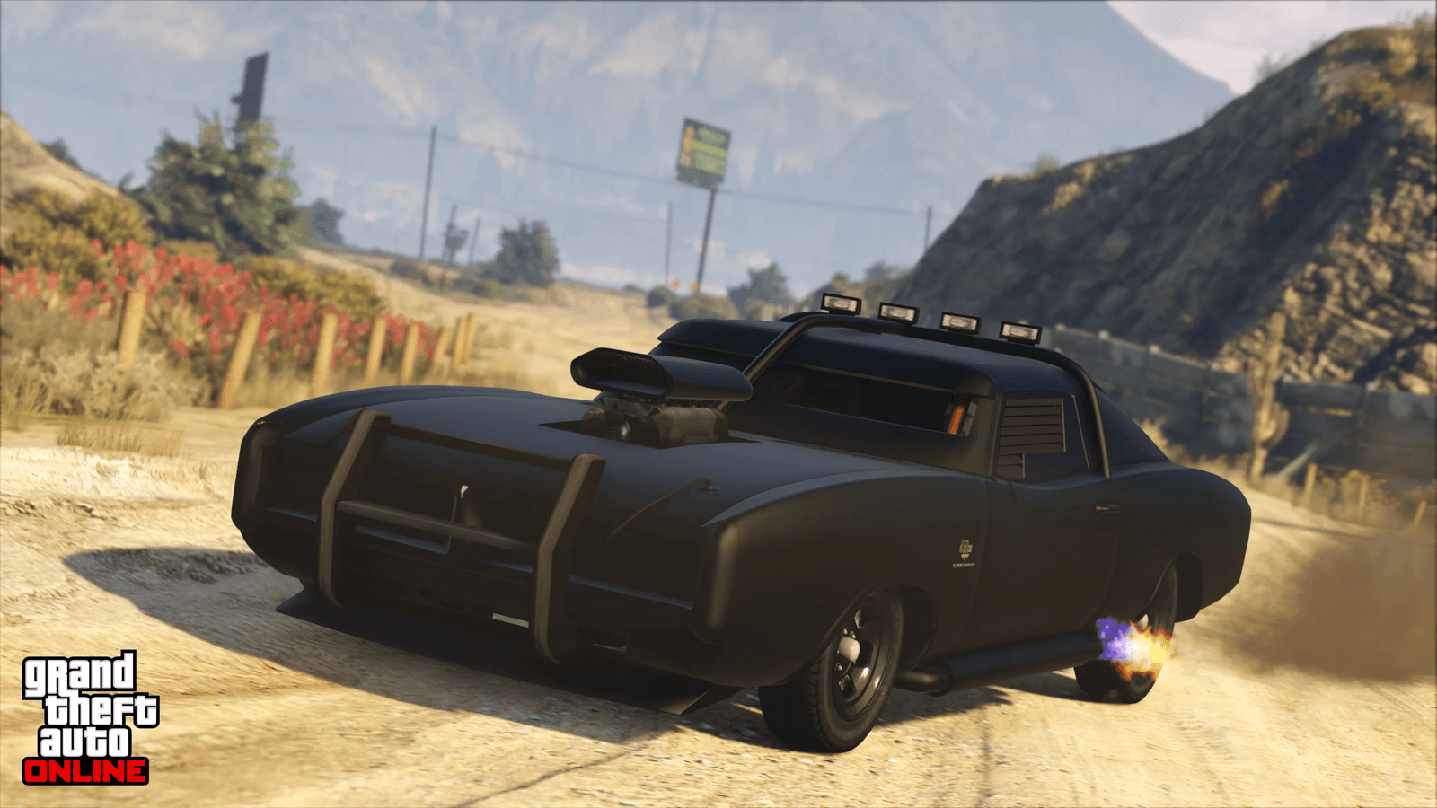 A black muscle car on a Los Santos back road in GTA Online