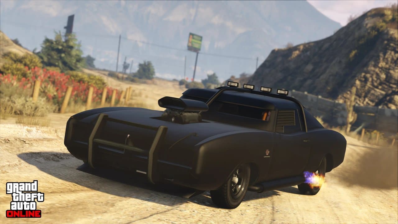 A custom black muscle car peeling out with flame exhaust in GTA Online