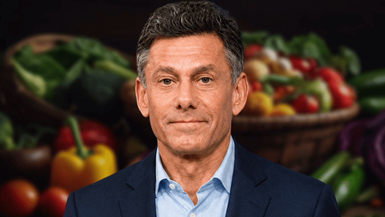 Take-Two CEO Strauss Zelnick in front of a blurred basket of fresh groceries