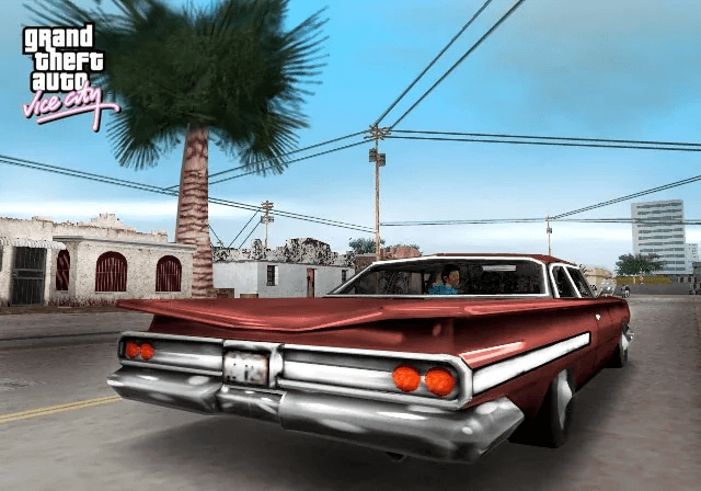 A floating hidden package collectible glowing on a Vice City street at dusk