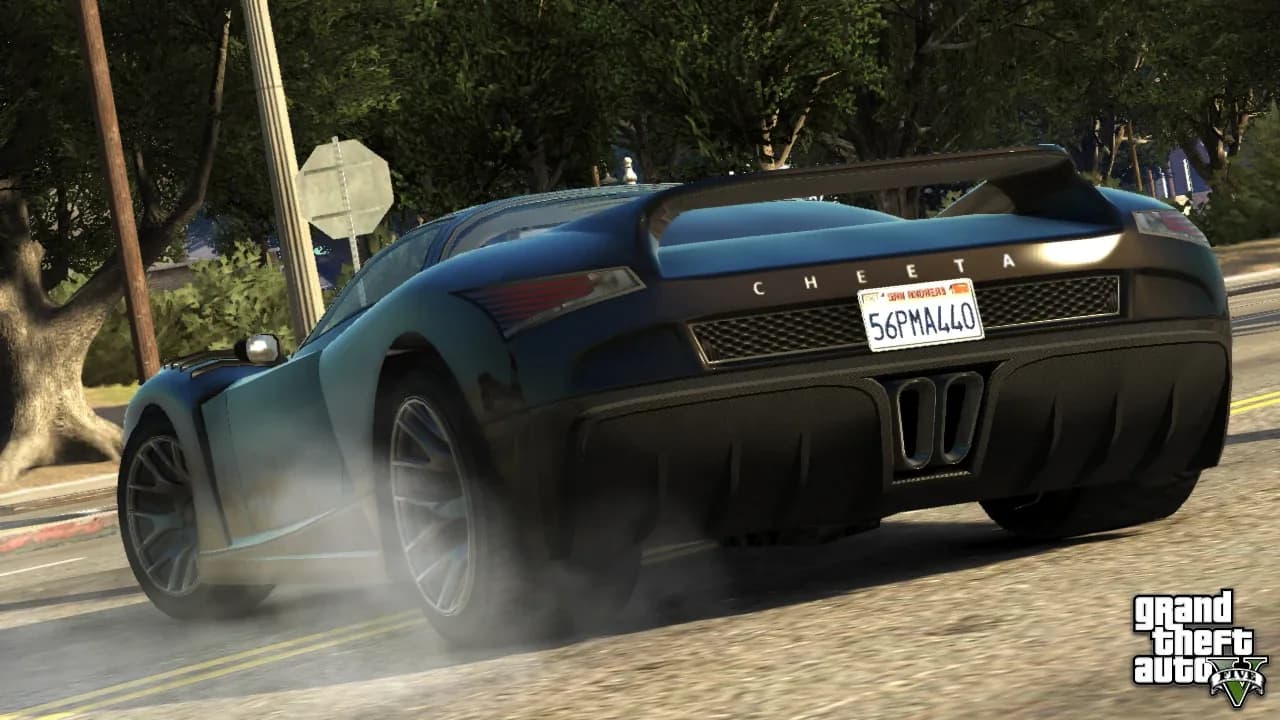 A red supercar speeding along a Los Santos highway in GTA 5