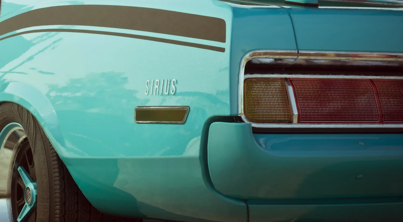 Close view of the rear of a turquoise muscle car with SIRIUS badged beside the tail lights