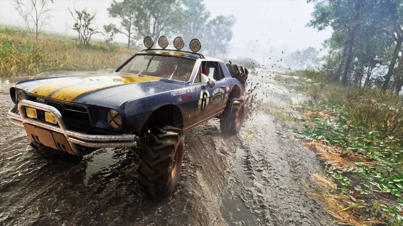 A lifted blue 1967 Vapid Dominator Buggy with yellow stripes and roof lights tearing through a muddy trail