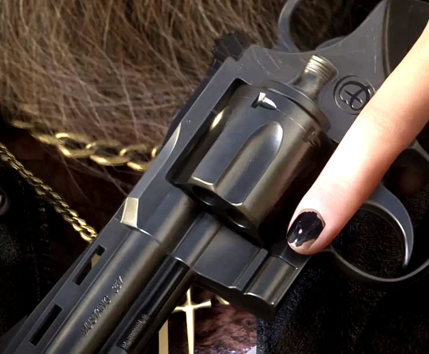 Close crop of a large-frame revolver barrel in a GTA 6 screenshot with MUSTANG .357 roll-marked along the barrel flat