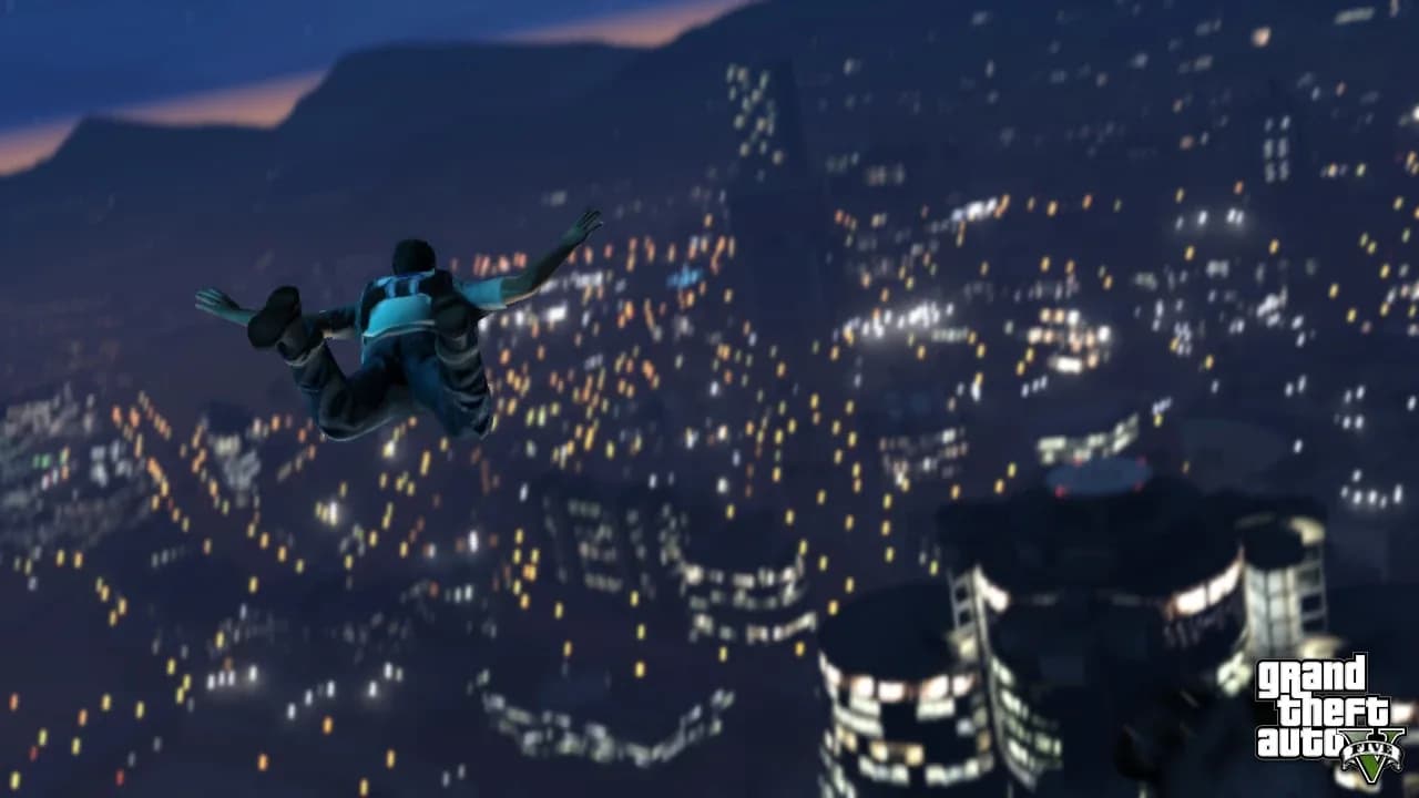 A skydiver falling past lit Los Santos skyscrapers at night in GTA 5, official screenshot