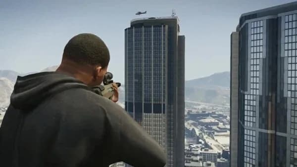 Franklin aiming a sniper rifle at the IAA tower from a nearby rooftop in GTA 5