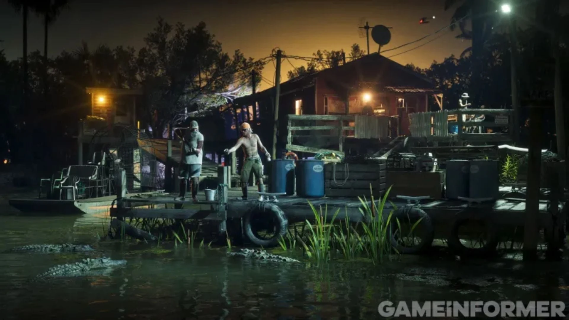 Alligators in the water beneath a swamp dock at night while two men stand on the dock