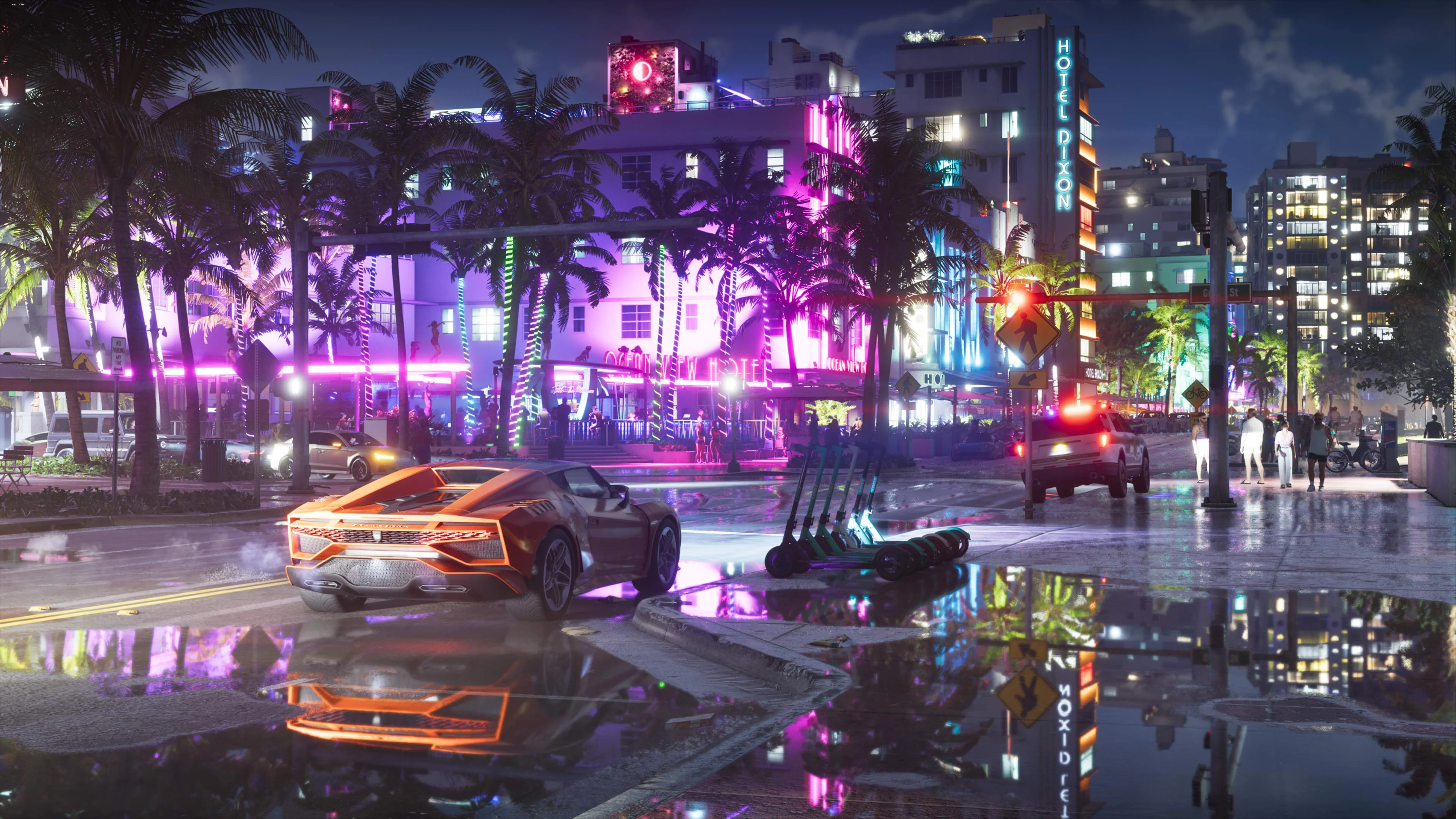 A rain-soaked Vice City street of neon hotels at night, with an orange supercar, a row of scooters, a police SUV and the Hotel Dixon's neon reflected in a puddle